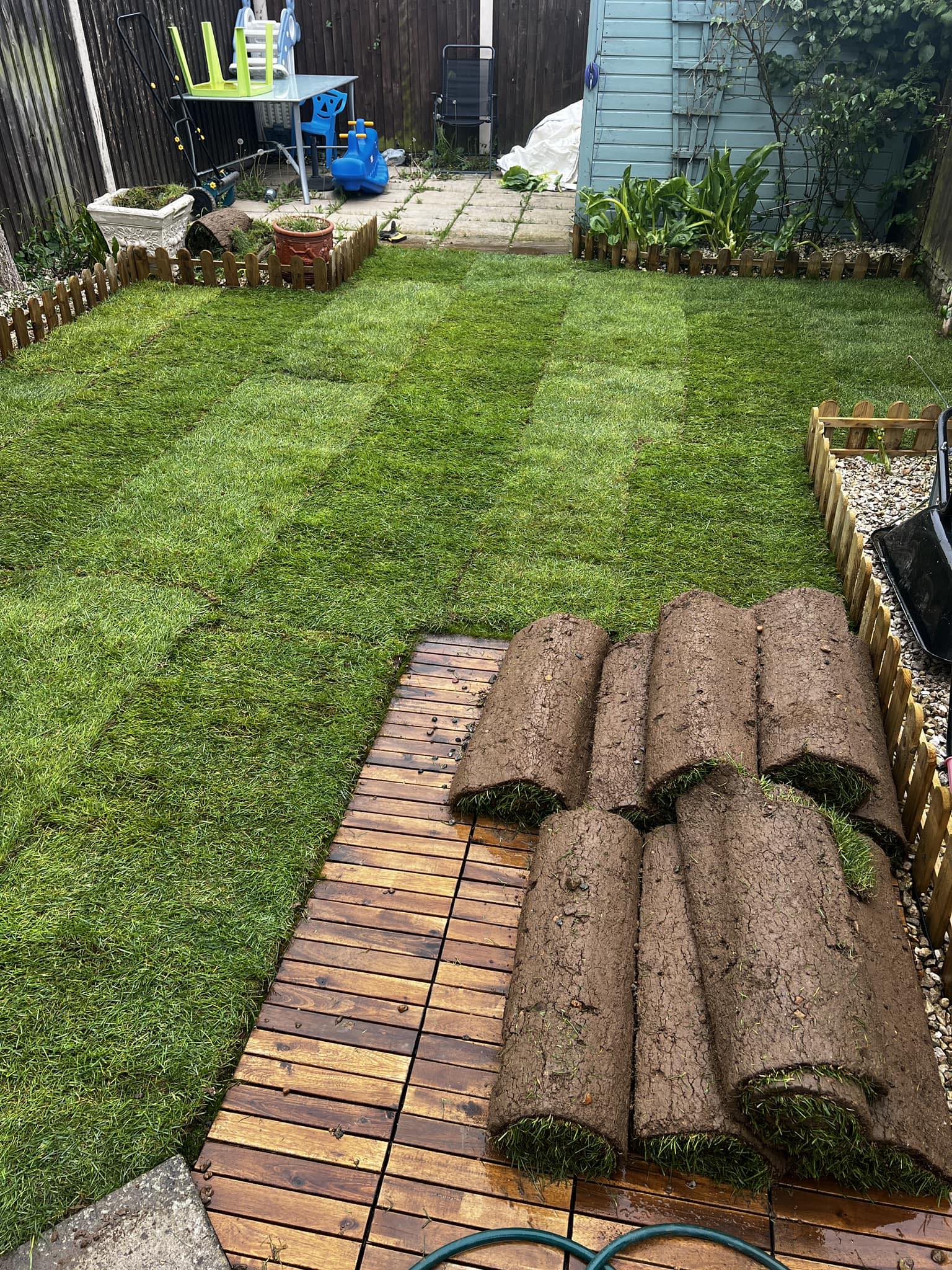 Lawn turf laid out in back garden