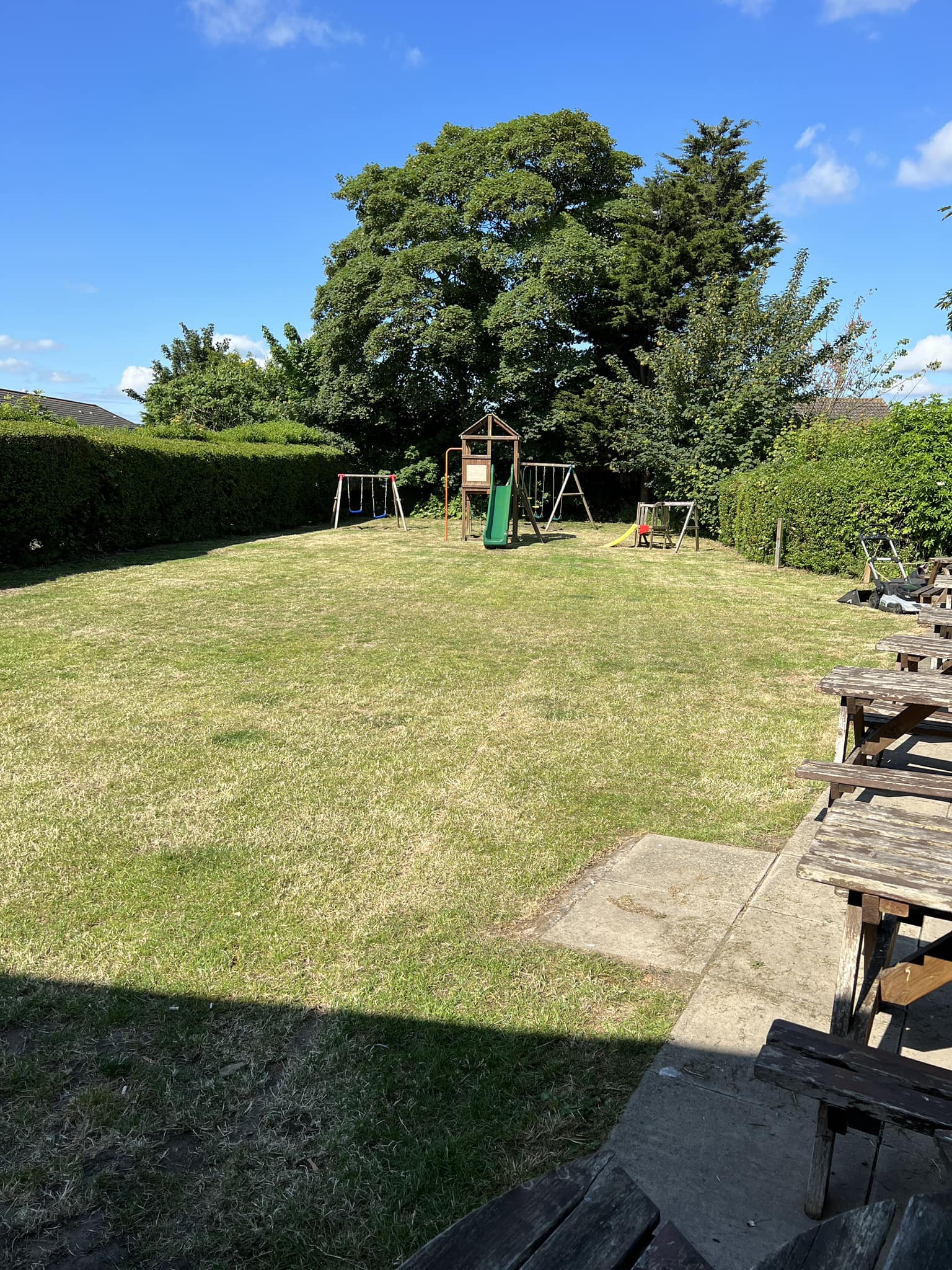 Large back garden with children's climbing frame